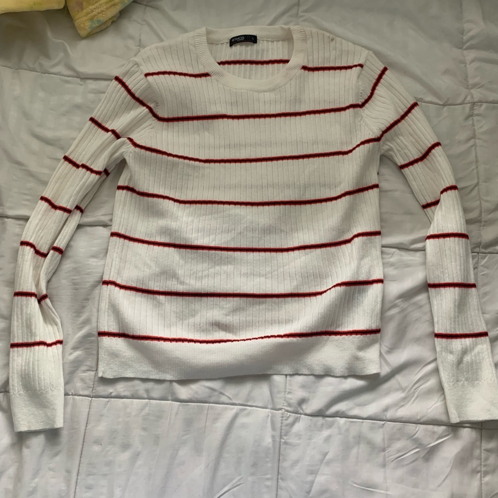 White sweater with red stripes